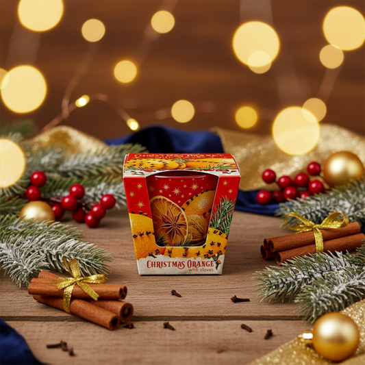 Christmas orange candle with festive background