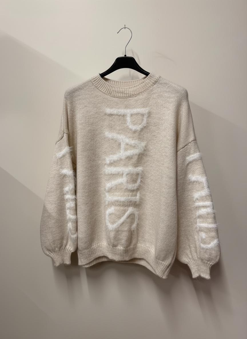 Cream PARIS sweater with neutral background