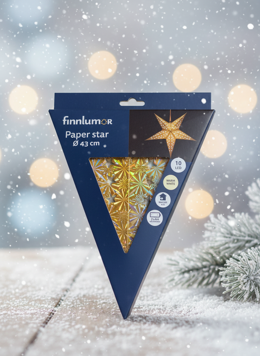 Gold paper star with winter background