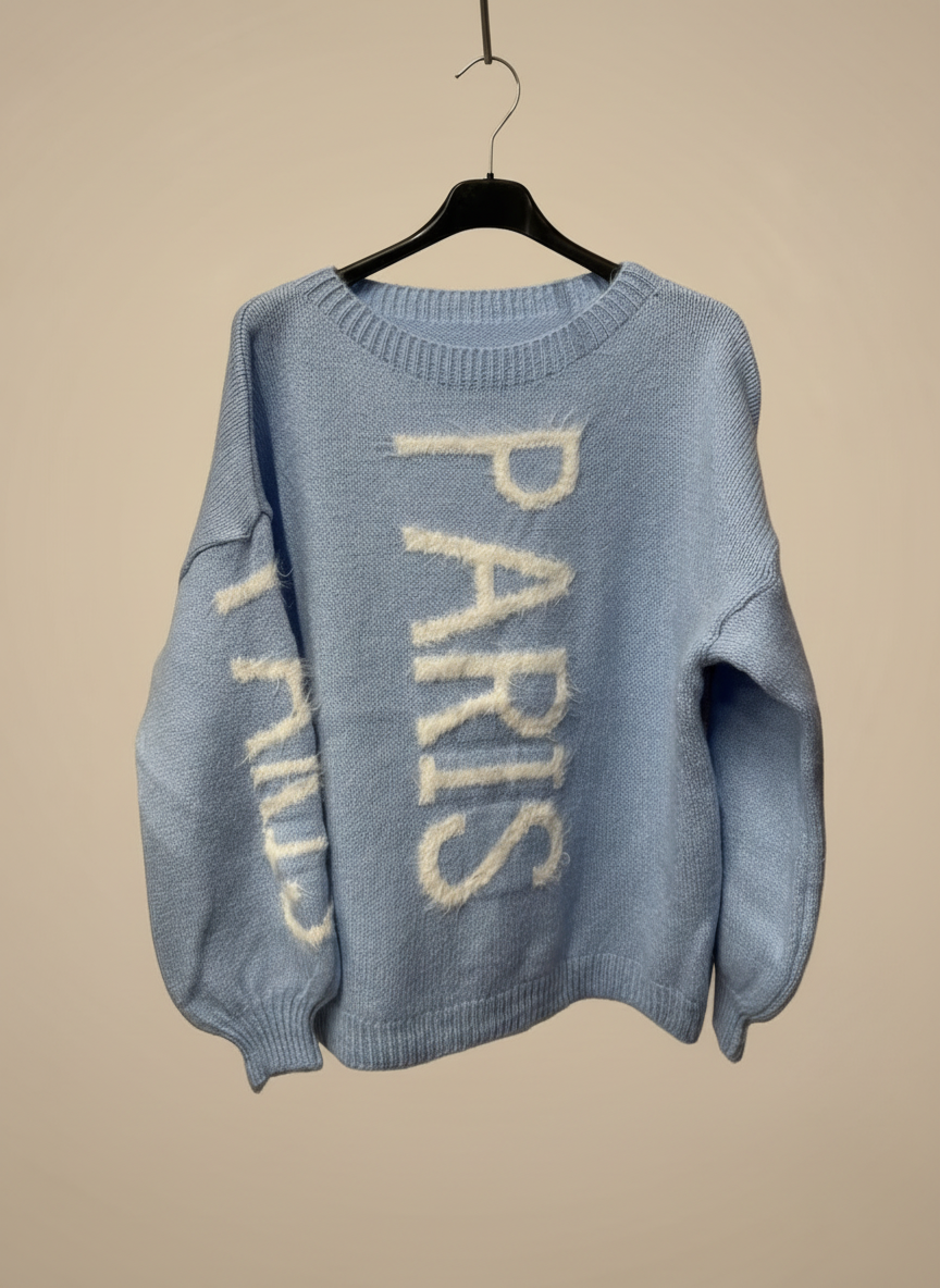 Light blue PARIS sweater with neutral background